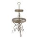 A 2-TIER ROUND IRON ETAGÈRE - BROWN