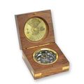A BRASS COMPASS IN WOODEN BOX