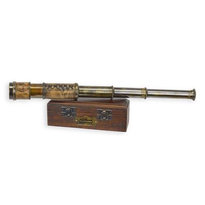 A BRASS MONOCULAR IN WOODEN BOX