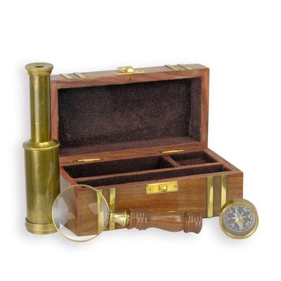 A BRASS SET OF NAUTICAL INSTRUMENTS IN WOODEN BOX