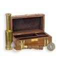 A BRASS SET OF NAUTICAL INSTRUMENTS IN WOODEN BOX