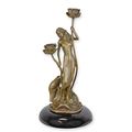 A BRONZE ART NOUVEAU CANDLEHOLDER