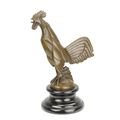 A BRONZE CAR MASCOT OF A ROOSTER