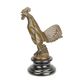 A BRONZE CAR MASCOT OF A ROOSTER