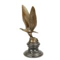 A BRONZE CAR MASCOTTE OF AN EAGLE ON GLOBE