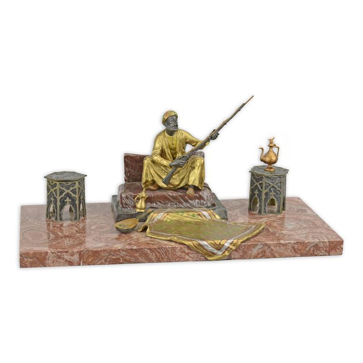 A BRONZE FIGURAL INK HOLDER OF AN ARAB TEA DRINKER