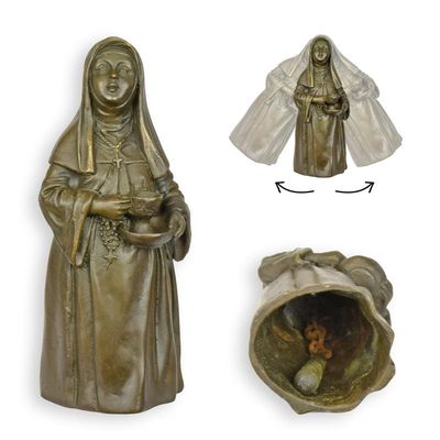 A BRONZE FIGURAL TABLE BELL OF A NON