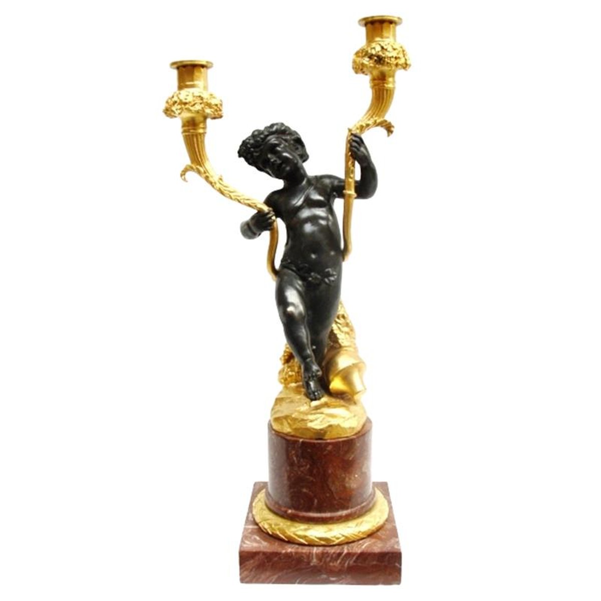 A BRONZE FIGURAL TWIN-BRANCH CANDELABRUM