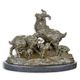 A BRONZE GROUP OF A FAMILY OF GOATS