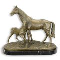 A BRONZE GROUP OF A HORSE AND COLT
