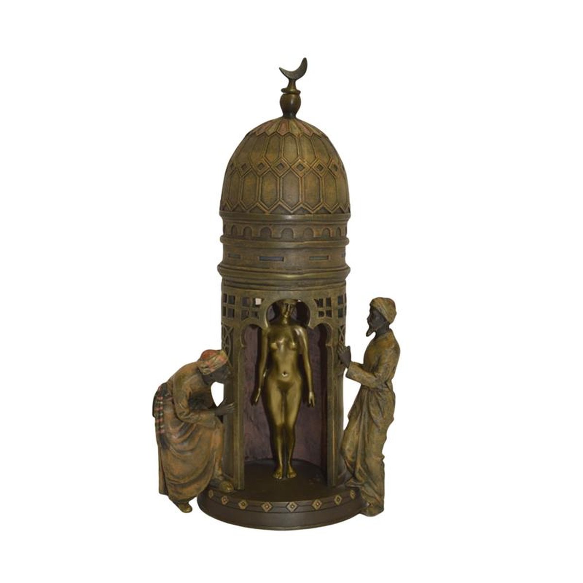 A BRONZE GROUP OF A NUDE IN TENT ACCOMPANIED BY TWO TRADERS