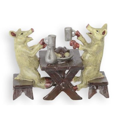 A BRONZE GROUP OF TWO PIGS HAVING DINNER