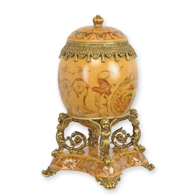 A BRONZE MOUNTED PORCELAIN EGG SHAPED BOX