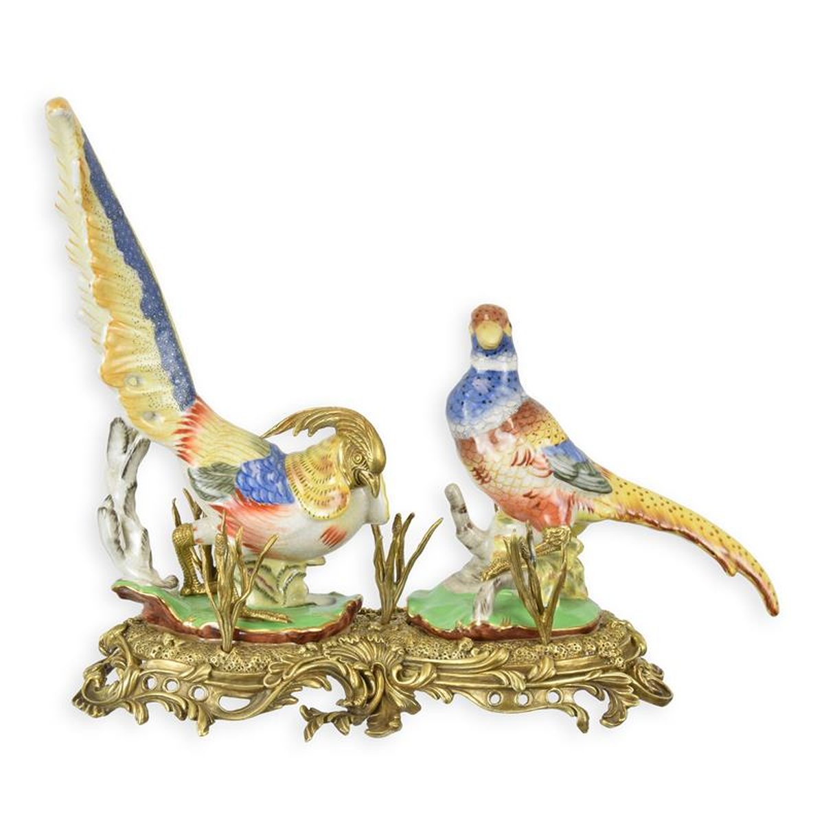 A BRONZE MOUNTED PORCELAIN GROUP OF PHEASANTS