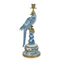 A BRONZE MOUNTED PORCELAIN PARROT CANDLE HOLDER