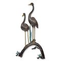 A BRONZE PAIR OF HERON FOUNTAIN