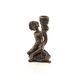 A BRONZE PUTTO CANDLESTAND
