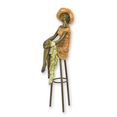 A BRONZE SCULPTURE CALLED SITTING AT THE BAR""