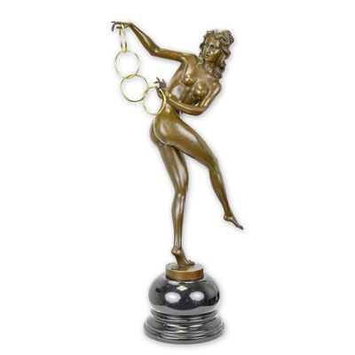 A BRONZE SCULPTURE CALLED THE MAGIC RINGS