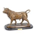 A BRONZE SCULPTURE OF A BULL