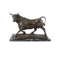 A BRONZE SCULPTURE OF A BULL