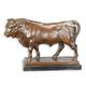 A BRONZE SCULPTURE OF A BULL