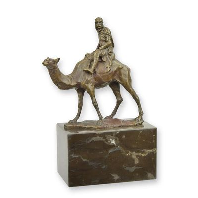 A BRONZE SCULPTURE OF A CAMEL AND RIDER