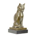A BRONZE SCULPTURE OF A CAT