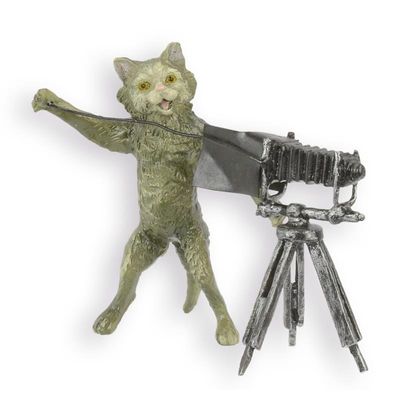 A BRONZE SCULPTURE OF A CAT PHOTOGRAPHER