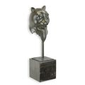 A BRONZE SCULPTURE OF A CATS HEAD