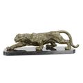 A BRONZE SCULPTURE OF A CROUCHING PANTHER