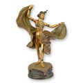 A BRONZE SCULPTURE OF A DANCER