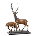 A BRONZE SCULPTURE OF A DEER COUPLE