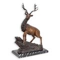 A BRONZE SCULPTURE OF A DEER ON A MARBLE BASE