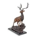 A BRONZE SCULPTURE OF A DEER