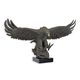 A BRONZE SCULPTURE OF A DESCENDING EAGLE