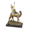 A BRONZE SCULPTURE OF A DROMEDARY AND RIDER