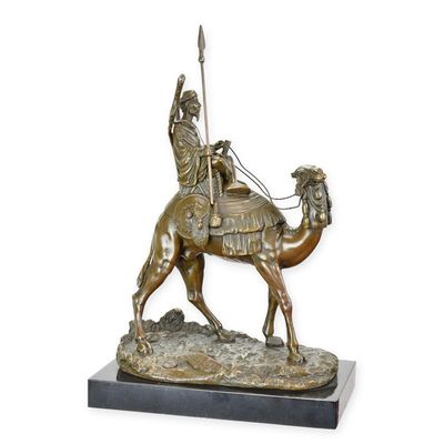 A BRONZE SCULPTURE OF A DROMEDARY AND RIDER