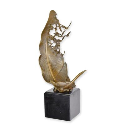 A BRONZE SCULPTURE OF A FEATHER AND FLYING DOVES