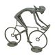 A BRONZE SCULPTURE OF A FEMALE CYCLIST