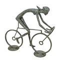 A BRONZE SCULPTURE OF A FEMALE CYCLIST