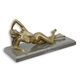 A BRONZE SCULPTURE OF A FEMALE NUDE