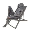 A BRONZE SCULPTURE OF A FEMALE NUDE IN BEACH CHAIR
