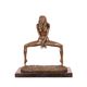 A BRONZE SCULPTURE OF A FEMALE NUDE