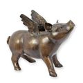 A BRONZE SCULPTURE OF A FLYING PIG