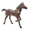 A BRONZE SCULPTURE OF A FOAL