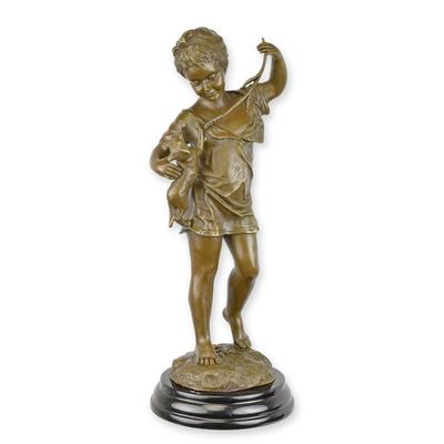 A BRONZE SCULPTURE OF A GIRL WITH CAT
