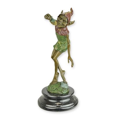 A BRONZE SCULPTURE OF A GOBLIN EATING GRAPES