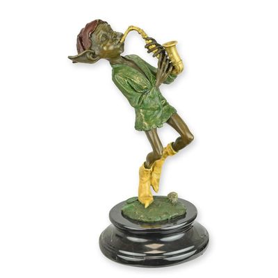 A BRONZE SCULPTURE OF A GOBLIN PLAYING SAXOPHONE