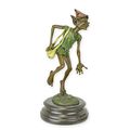 A BRONZE SCULPTURE OF A GOBLIN SOWING SEEDS